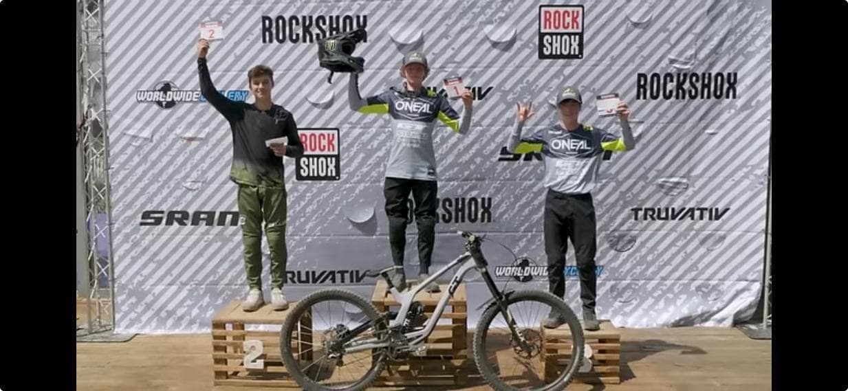 Chris Liebig on the podium at RockShox event